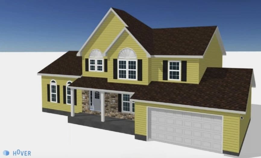 Yellow two-story house with brown roof, garage, and stone porch